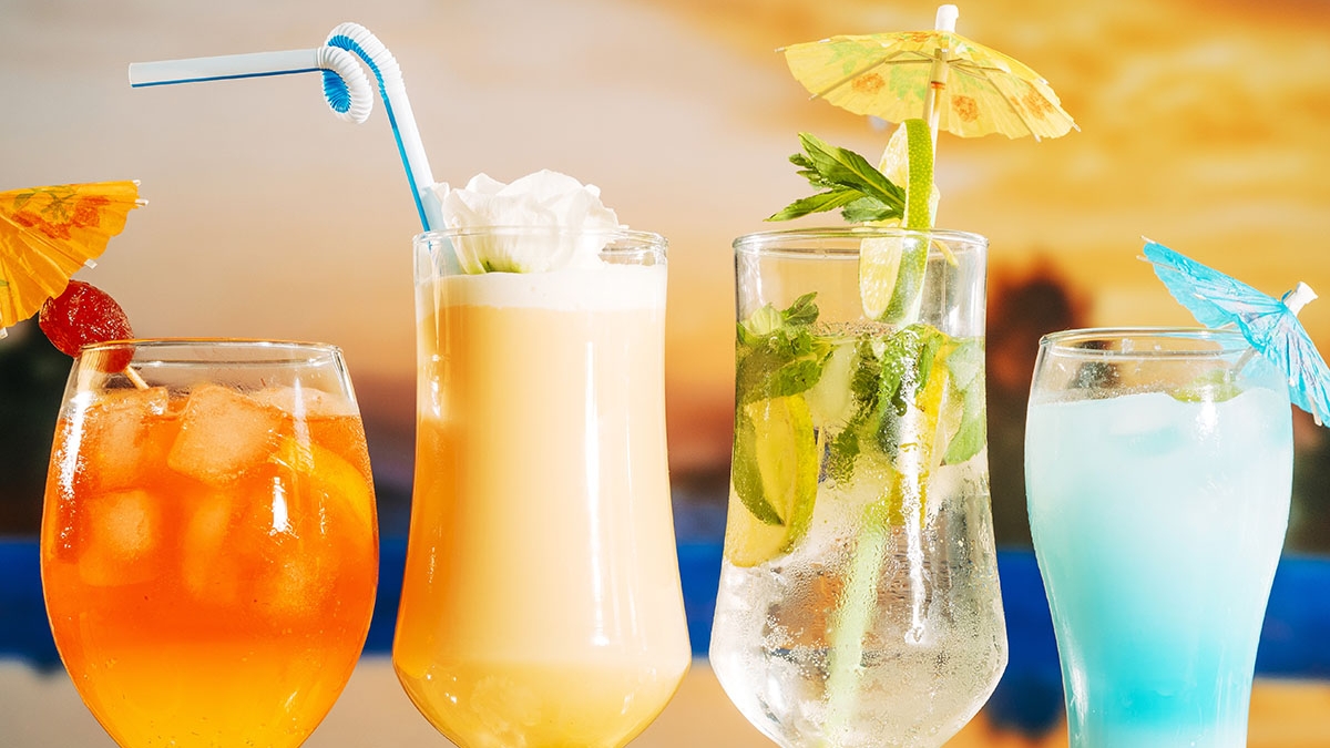 orange-soft-yellow-drinks-with-strawberry-sliced-lime-mint-in-glasses